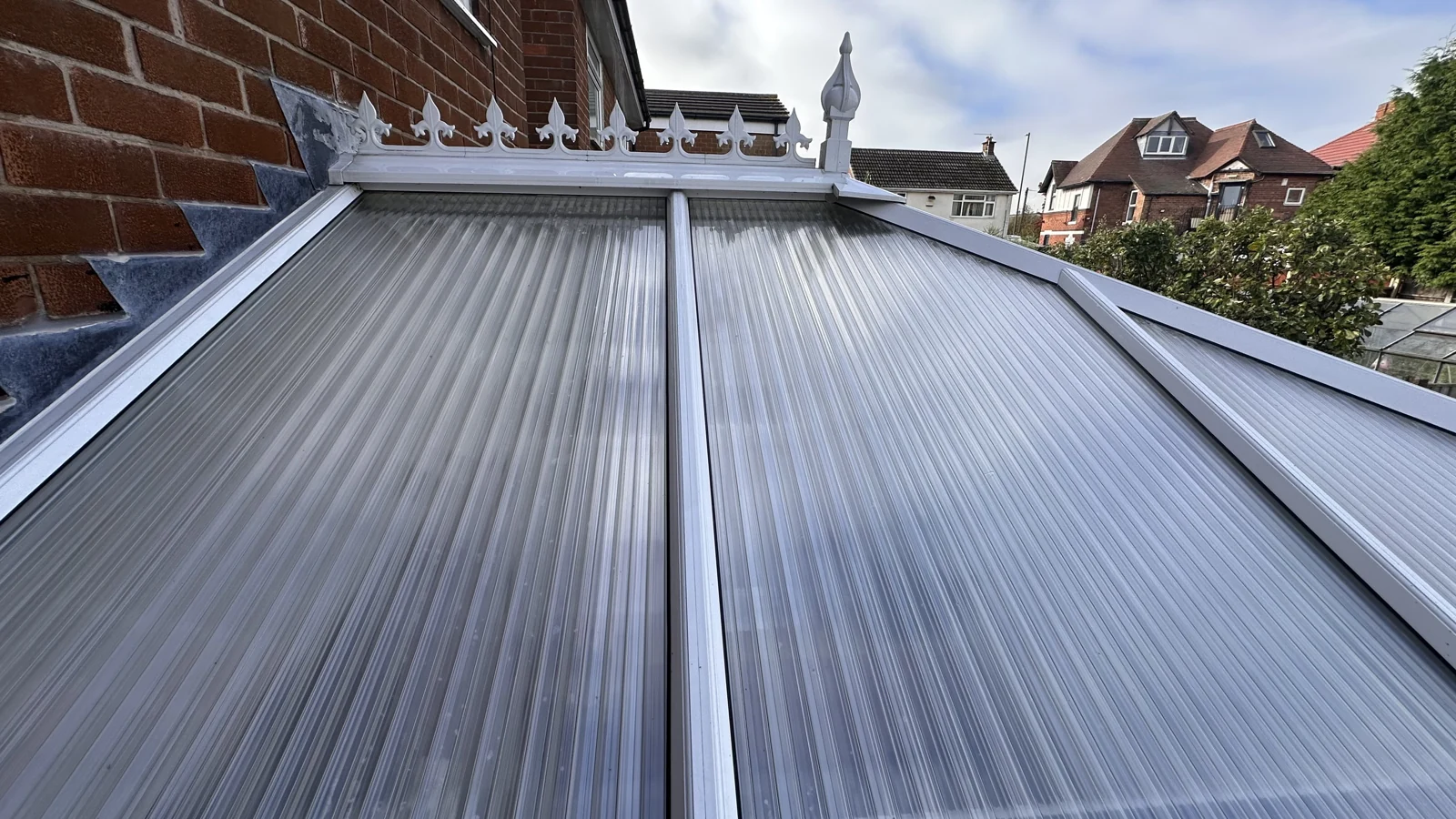 Clean conservatory roof panels and white frames