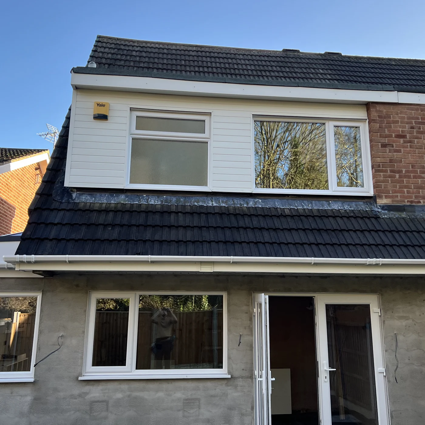 Roof tiles and white uPVC after cleaning